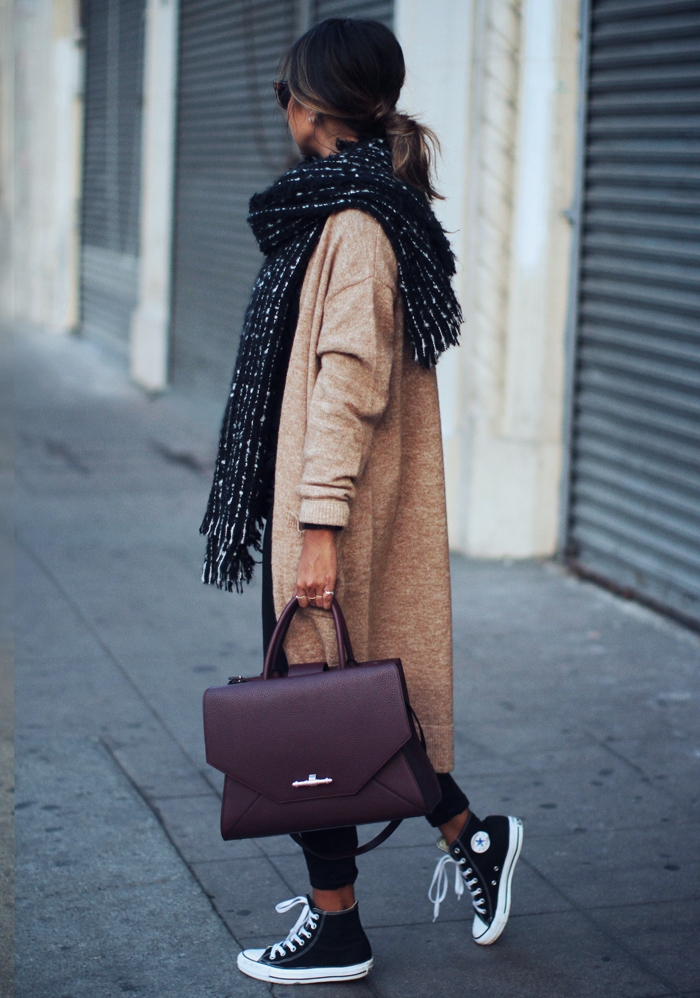 Julie Sarinana demonstrates the versatility of converse here, wearing them with a more sophisticated work look consisting of an oversized knit cardigan and a gorgeous Givenchy briefcase. Cardigan: Asos, Jeans: Asos, Shoes: Converse, Scarf: Zara, Bag: Givenchy.