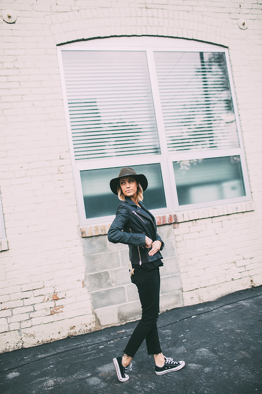 Try wearing your converse with skinny black jeans and a leather jacket. Via Megan Anderson. Jacket: IRO, T-Shirt: Revolve Clothing, Jeans: JBrand.