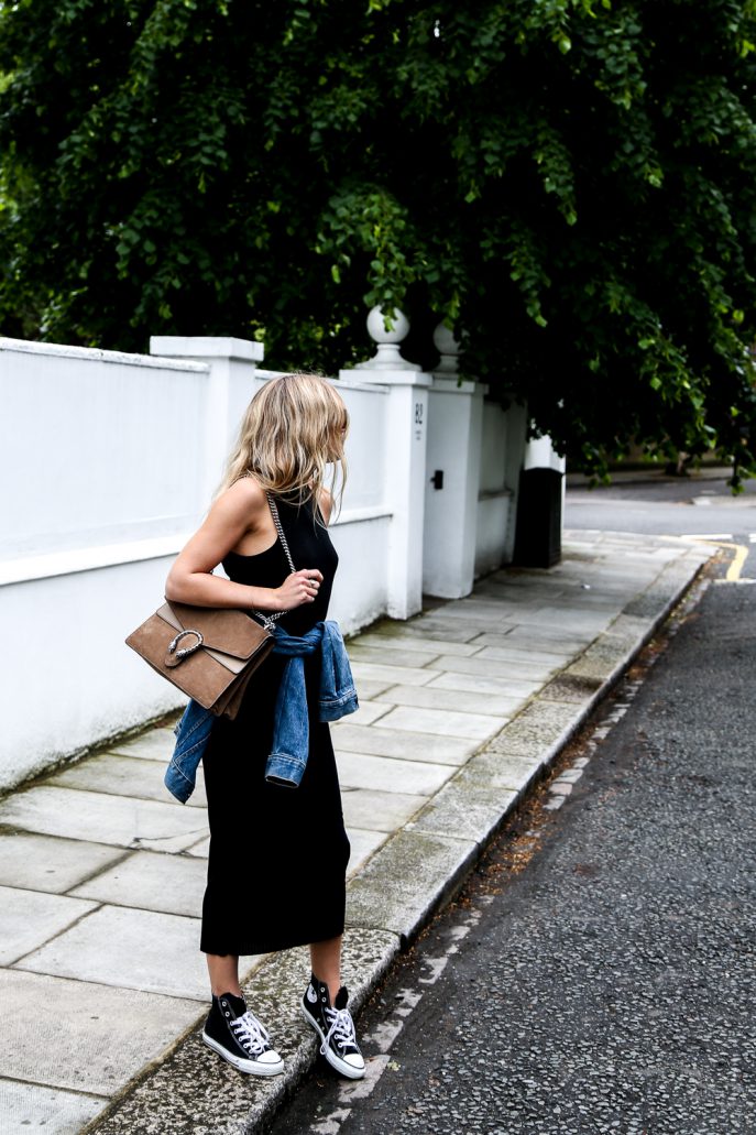 Lucy Williams has paired classic black Chuck Taylor Converse with a midi dress here for a retro and vintage style which is perfect for summer! Wear this look with a denim jacket like Lucy to get that authentic fifties feel! Dress: Mango, Jacket: Levis, Bag: Gucci, Trainers: Converse. 