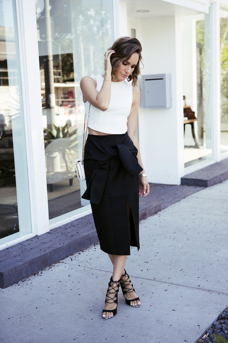 Louise Roe is going back to basics with black and white – even down to her white pedicure and we can’t get enough. With pencil skirts traditionally being made in black, this is one of the easiest outfits to style, but always remains current. Pair a black skirt and white top with colorful heels or statement jewelry to add even more zest to this anytime style. Skirt: Cmeo Collective, Top: Finders Keepers, Shoes: Monique Lhuillier, Purse: Jimmy Choo, Watch: Tory Burch